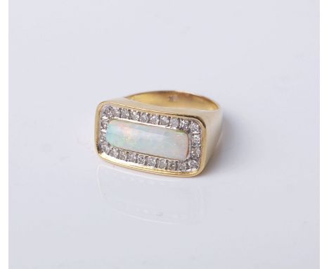 A vintage gold, white opal and diamond oblong cluster ring, the central rectangular cabochon white opal within a small eight-