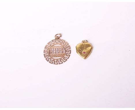 A gold heart-shaped locket, set with a small round ruby, 2.4g gross and a Continental gold round pendant pierced with a row o