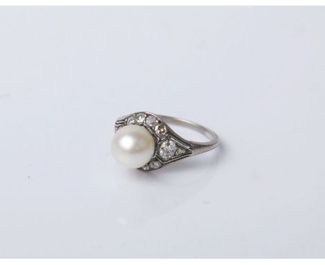 An early 20th century cultured-pearl and diamond cluster ring; the 8mm diameter cultured-pearl within an old-cut diamond ten 