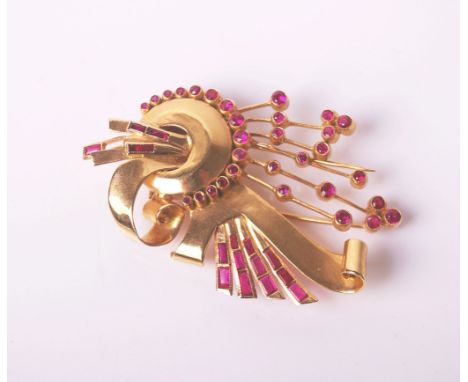 A 1940's style gold and synthetic-ruby odeonesque brooch in the form of scrolls, arches and stems, unmarked, approx 5.5cm lon