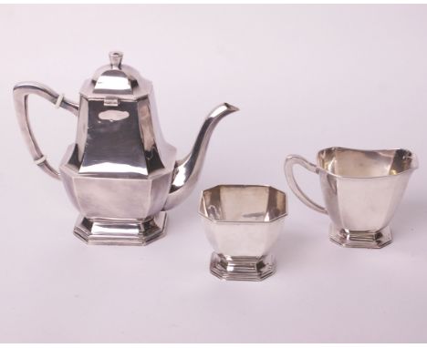 A canted-rectangular three piece tea service, each on a stepped moulded foot, stamped beneath ‘Sterling 925’, 1040g gross