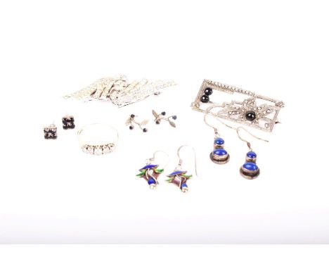 A collection of silver and white metal jewellery, including; A silver curb link ‘charm’ bracelet on a padlock clasp, Birmingh