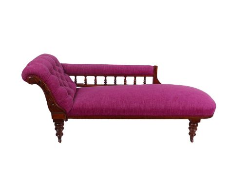 A Victorian chaise longue, carved mahogany frame with balustrade arm rest, recently button upholstered, 185cm wide