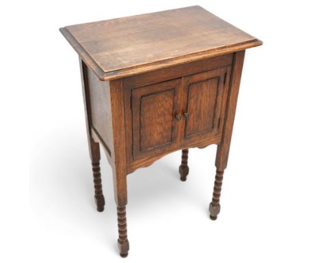 Small early 20th century oak two door hutch cupboard, beaded decoration, on bobbin-turned supportsDimensions: Height:&nbsp;78