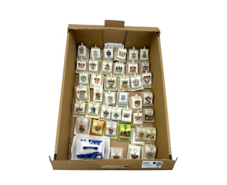 Collection of crested ware miniature cheese dishes and covers, including one by Goss, in one box