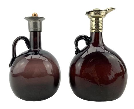 Late 19th/ early 29th century Continental ruby glass claret jug with white metal hinged cover H20cm and an amethyst glass cla