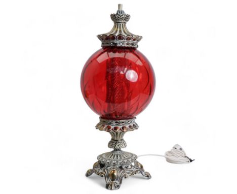 Vintage pierced brass table lamp in the form of an oil lamp, with red glass shade, H61cm