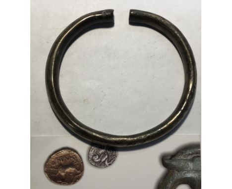 Celtic Gallo-Belgie Silver Bangle 100-50BC (with card of original seller).

Approximately 78mm diameter, 67.3g.