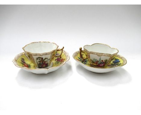 Two similar 19th Century Dresden yellow ground cups and saucers