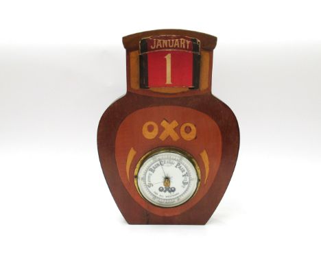 An Oxo advertising aneroid barometer in the form of a jar of Oxo, with calendar section 
