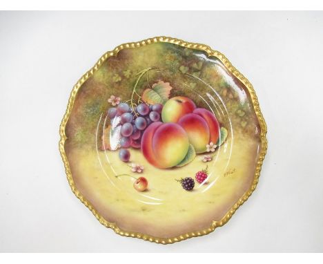 A Royal Worcester handpainted fruit study plate with gilt embellishment, painted by P. Platt, 27cm diameter