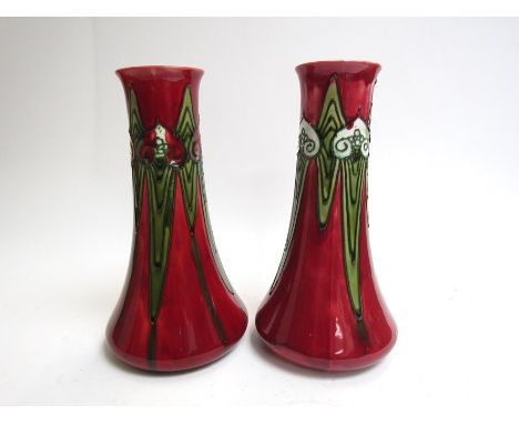 Two Minton successionist ware vases. 25cm high.