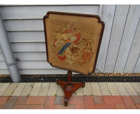 A 19th Century rosewood polescreen with tapestry panel, 82.5cm high