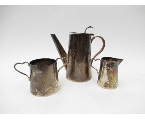 A Viners Limited (Emile Viner) silver three piece bachelor's coffee set consisting of coffee pot with caned handle, cream jug