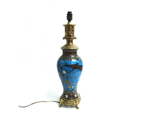 An early 20th Century cloisonné table lamp with gilt metal base and fitting, converted to electrical, 56.5cm high