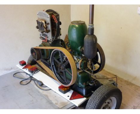 A full size Petter M 1½ B.H.P. 'pear-top' patent stationary oil engine, fitted with twin flywheels, engine number 1883, overa