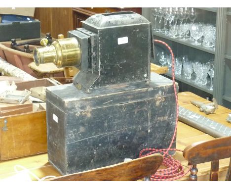 A late 19thC Magic Lantern, with a large wooden box containing approx. 300 slides, subjects include Queen Victoria, The Empir