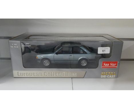 A boxed Sun Star 1:18 scale diecast model of a Ford Escort 1981. 