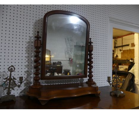 A Victorian mahogany Dressing table Mirror,&nbsp;the plate raised on barley-twist supports and carved feet, 26in (66cm) wide 