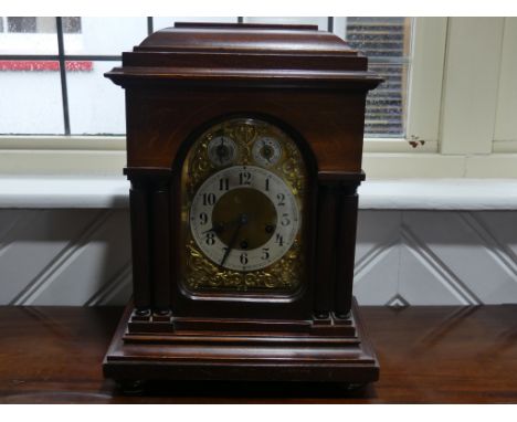 An early 20th century Junghans chiming Mantel Clock, the brass ached dial with silvered chapter ring and Arabic numerals, chi
