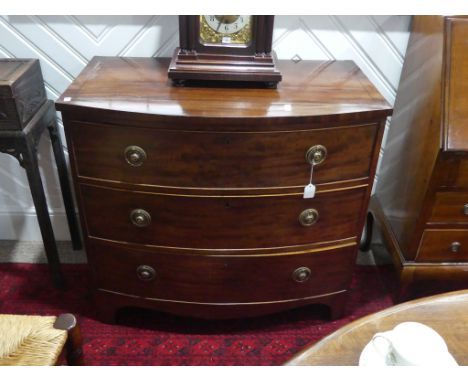 An early 19thC mahogany bowfront Chest of Drawers, three long drawers, with brass fittings, raised on splayed bracket feet, 3