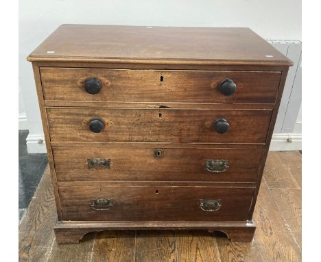 A Georgian mahogany Chest of Drawers, two short above three long cock-beaded drawers, raised on bracket feet, with later, mis