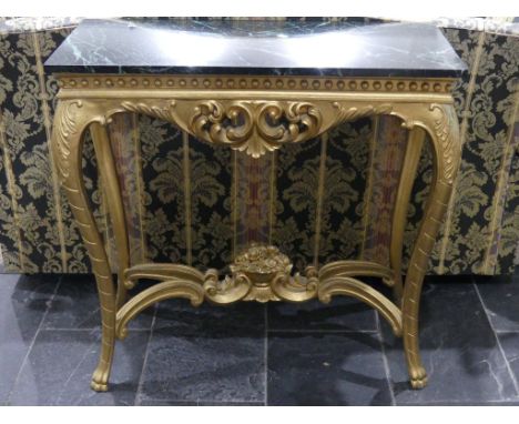 An early 20thC gilt painted and marble topped Console Table,&nbsp;the profusely moulded apron, raised on somewhat cabriole le