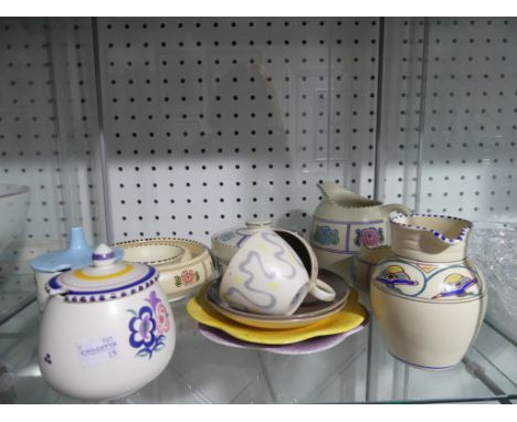 A small quantity of Poole Pottery;&nbsp;comprising a Poole Pottery Shell, Jug, two Tea Cups and Saucers, Preserve pot etc, to