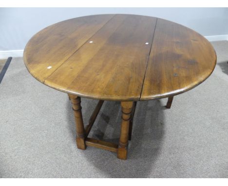 A Multiyork 19thC Style oak Gate-leg Table,&nbsp;the oval top raised on turned legs, 64in (162cm) long x 56in (142cm) wide x 