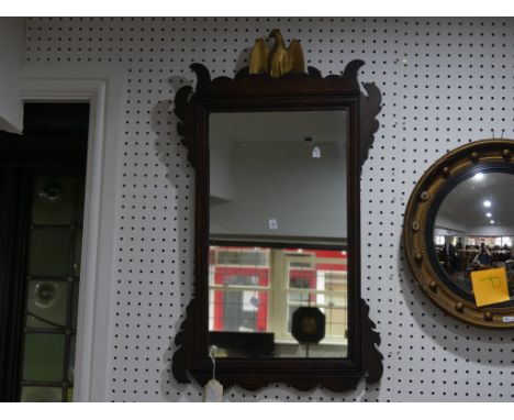 An antique oak rectangular Wall Mirror,&nbsp;with moulded frame&nbsp;surmounted with a giltwood eagle, 19in (48cm) x 33in (83