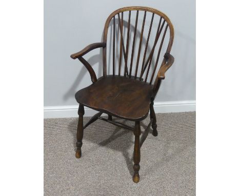 A 19thC ash and elm Windsor Chair, the hoop and stick back with scrolled arms, raised on H-stretcher and turned legs, 22in (5