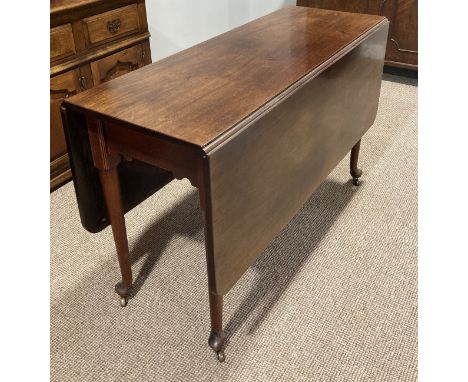 A Victorian mahogany Gate-leg Dining Table,&nbsp;raised on pad feet, brass caps and castors, 51in (130cm) wide x 48in (122cm)