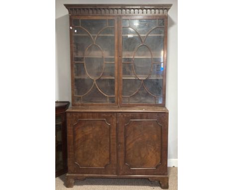 A 19thC mahogany astragal glazed Bookcase,&nbsp;the moulded cornice above two glazed doors, enclosing shelved interior, upon 