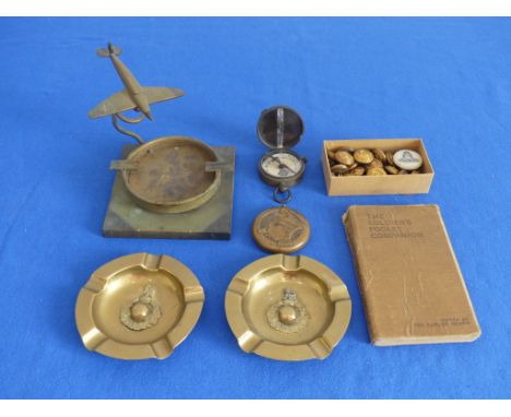 A quantity of Militaria and Trench Art, including military monoplane ashtray, pair brass ashtrays, military Verner Compass, m