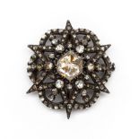 14 kt. Goud met zilveren broche, tevens hanger.