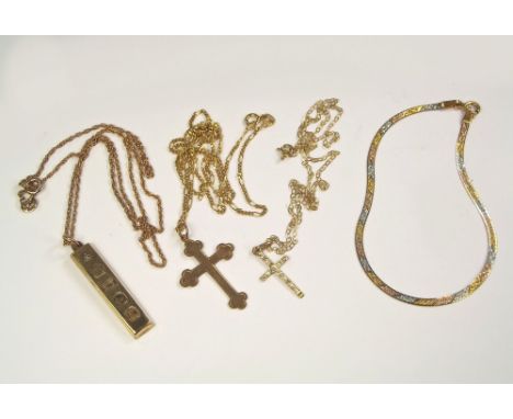 GOLD CROSSES ETC. A 9ct. gold cross, one other cross on a 9ct. gold chain, a 9ct. gold ingot pendant with 9ct. gold chain & a