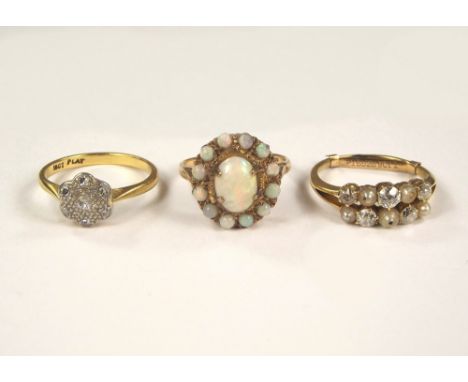 OPAL RING ETC. A 9ct. gold opal cluster ring, an 18ct. gold & platinum illusion set diamond ring & one other dress ring.