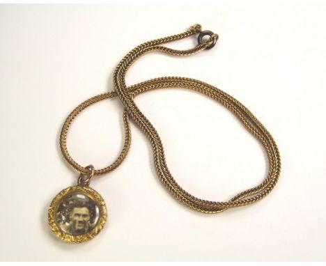 PHOTO LOCKET & CHAIN. A 9ct. gold chain, hung a photo locket, the back initialled & dated 1829. Total weight approx. 11g.