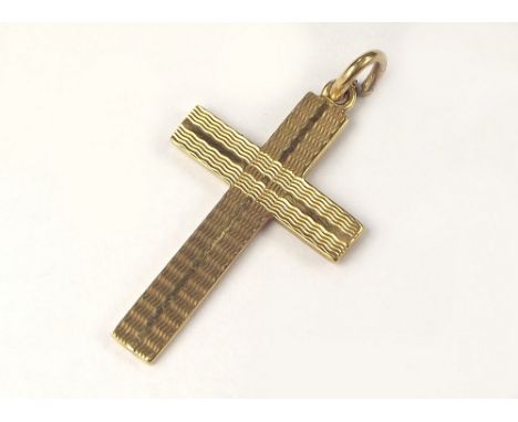 GOLD CROSS. A 9ct. gold engine turned cross.