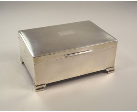 CIGARETTE BOX. A sandalwood lined silver cigarette box with engine turned lid. Birmingham 1958. 9 x 13cm.