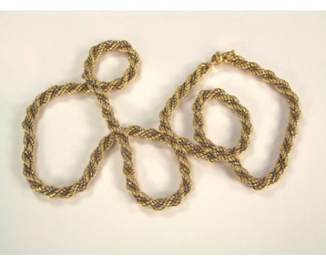 GOLD CHAIN.An 18ct. yellow & white gold twist rope chain necklace. 35.5g.