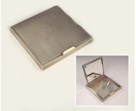 POWDER COMPACT. An Art Deco, heavy gauge, engine turned silver powder compact with silver gilt thumb piece. 7.5 x 7.5cm. Appr