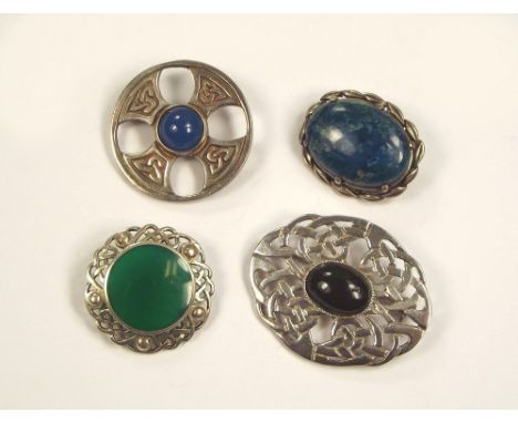 SILVER BROOCHES. A Scottish Celtic cross brooch & three other Celtic inspired silver brooches.