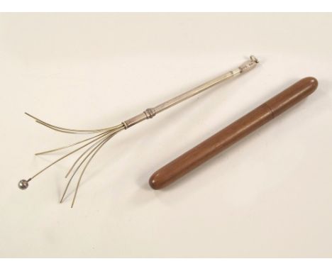 SWIZZLE STICK. A silver swizzle stick in fruit wood case.