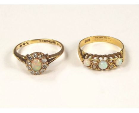 OPAL RINGS. Two 18ct. gold & diamond set dress rings.