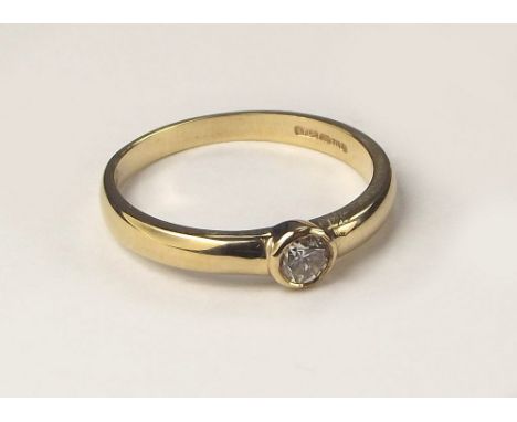 DIAMOND RING. A 9ct. gold solitaire diamond ring, the stone of approximately 0.15ct. Size K/L.