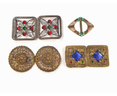 BUCKLES. Three stamped brass, two-part buckles & a cold painted enamel buckle.