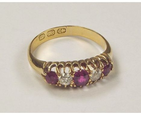 GOLD RING. An 18ct. gold ruby & diamond ring. Size L.