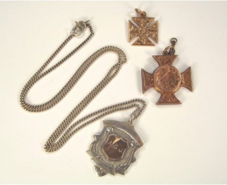 FOBS. A silver & silver gilt fob presented at The 'Camborne Festival, 1934', on a chain; a 9ct. gold Maltese Cross charm; and