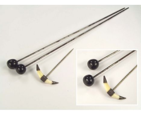 HAT PINS ETC. Two Edwardian black glass hat pins & a silver mounted stick pin.